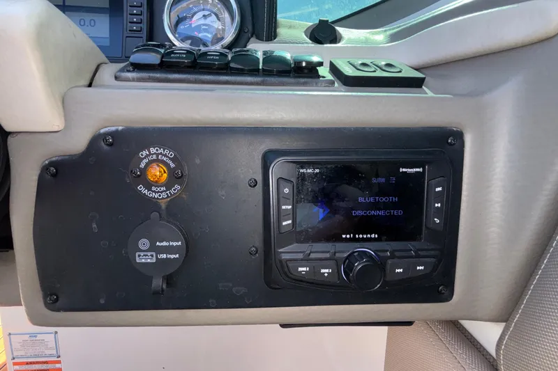 Slide: The Image of Dashboard of a 2020 Crownline 290 SS boat with audio system and diagnostics. - 30