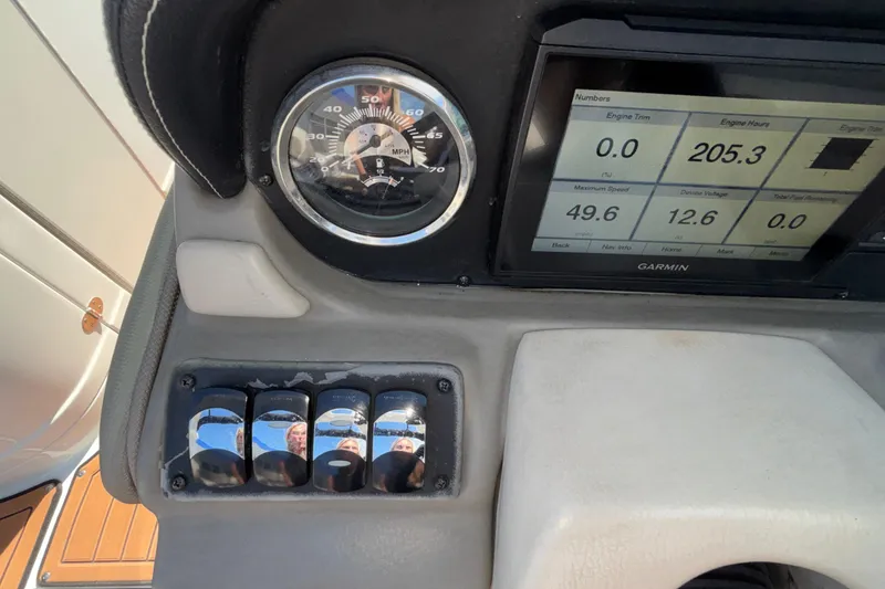 Slide: The Image of Dashboard of 2020 Crownline 290 SS boat with Garmin display and speedometer. - 31