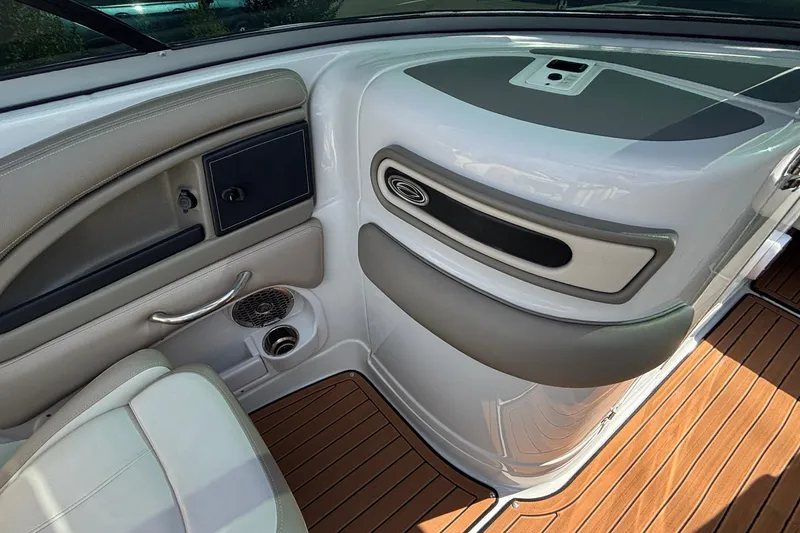 Slide: The Image of Interior of 2020 Crownline 290 SS boat with sleek design and wood flooring. - 33