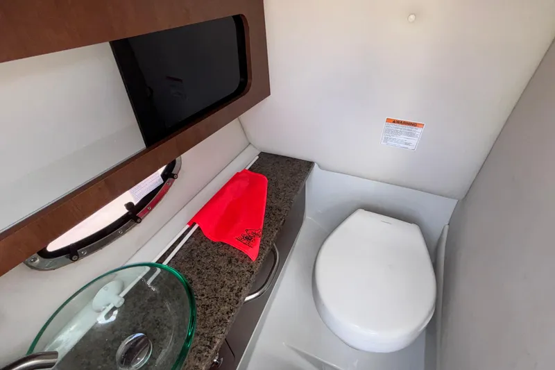 Slide: The Image of 2020 Crownline 290 SS boat bathroom with modern sink and toilet. - 37
