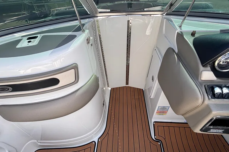 Slide: The Image of 2020 Crownline 290 SS boat interior with sleek design and wood-textured flooring. - 39