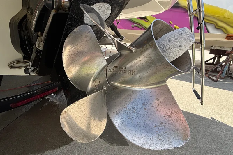 Slide: The Image of Close-up of a 2020 Crownline 290 SS boat propeller, showcasing its metallic blades. - 4