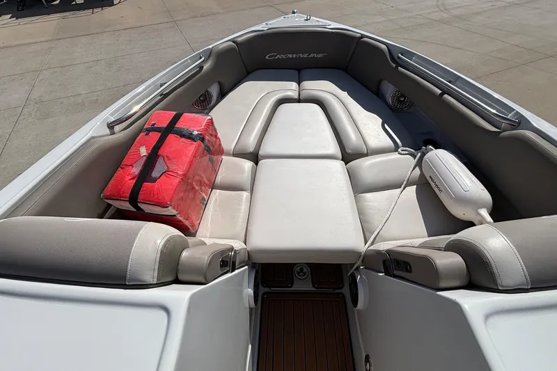 Slide: The Image of 2020 Crownline 290 SS boat interior with cushioned seating and safety equipment. - 41