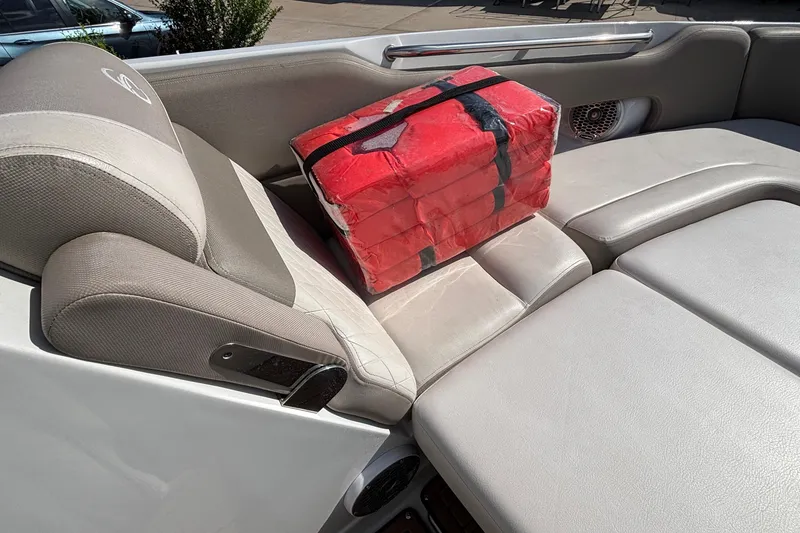 Slide: The Image of Crownline 290 SS boat interior with red package on beige seating, 2020 model. - 42