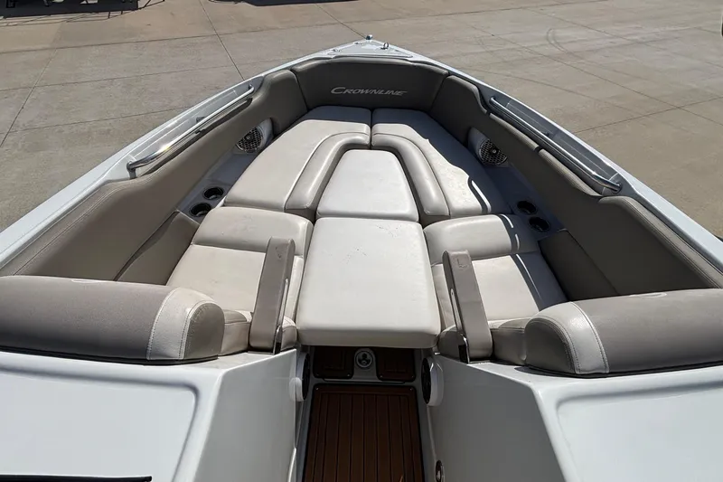 Slide: The Image of 2020 Crownline 290 SS boat interior with spacious seating and cup holders. - 44