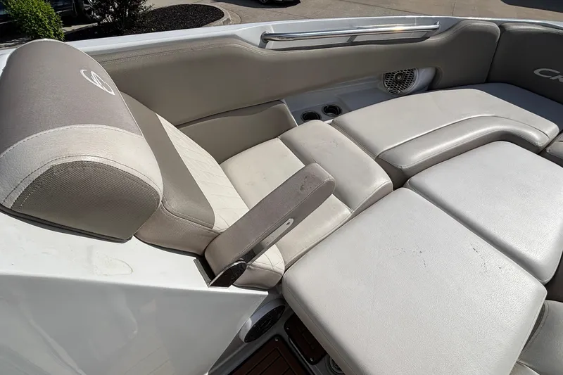 Slide: The Image of 2020 Crownline 290 SS boat interior with beige seating and armrest. - 46