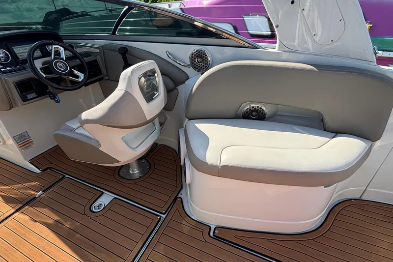 Slide: The Image of Interior of 2020 Crownline 290 SS boat with sleek seating and modern dashboard. - 53