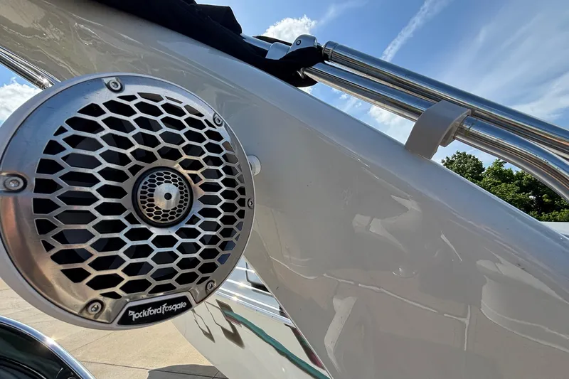 Slide: The Image of Close-up of Rockford Fosgate speaker on 2020 Crownline 290 SS boat, under clear blue sky. - 54