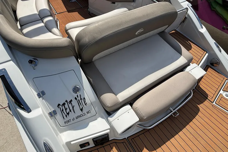 Slide: The Image of 2020 Crownline 290 SS boat interior with cushioned seating and teak flooring. - 6