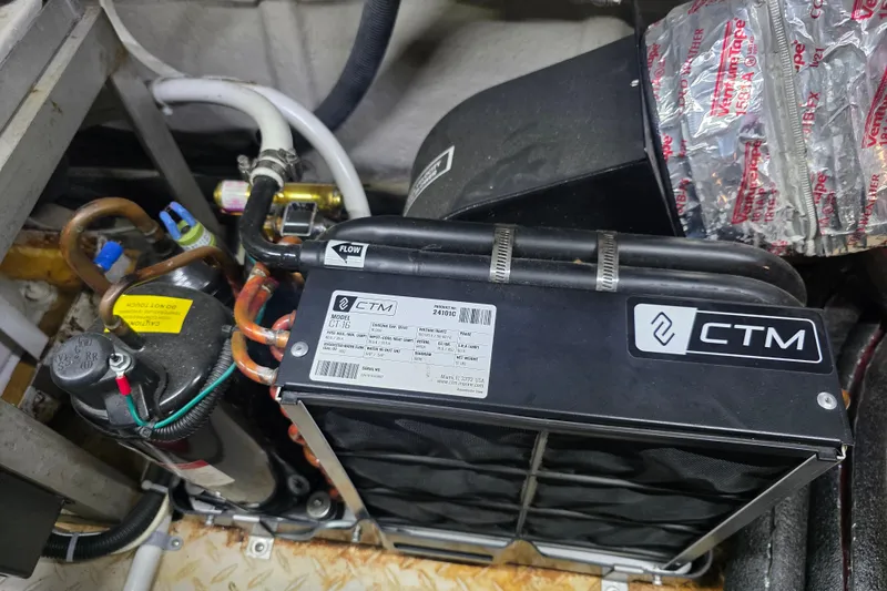 Slide: The Image of Engine compartment of a 2002 Sea Ray 560 Sedan Bridge with CTM equipment. - 141