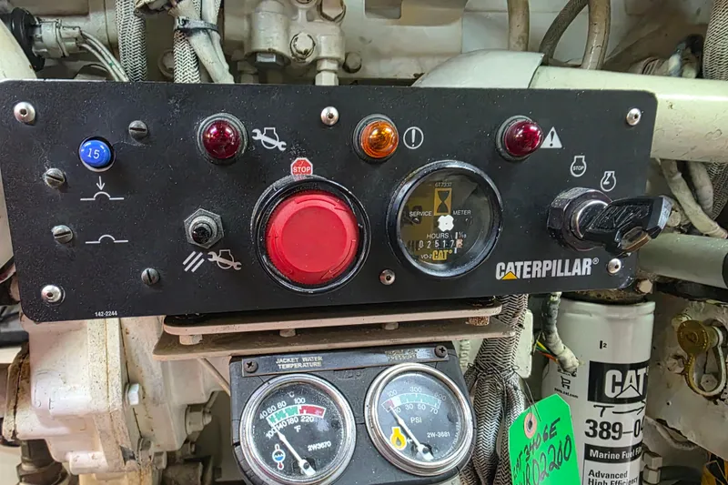 Slide: The Image of Control panel of a 2002 Sea Ray 560 Sedan Bridge with Caterpillar engine gauges. - 150