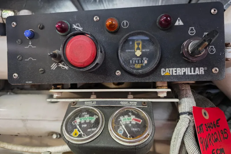 Slide: The Image of Caterpillar engine control panel on a 2002 Sea Ray 560 Sedan Bridge yacht. - 151