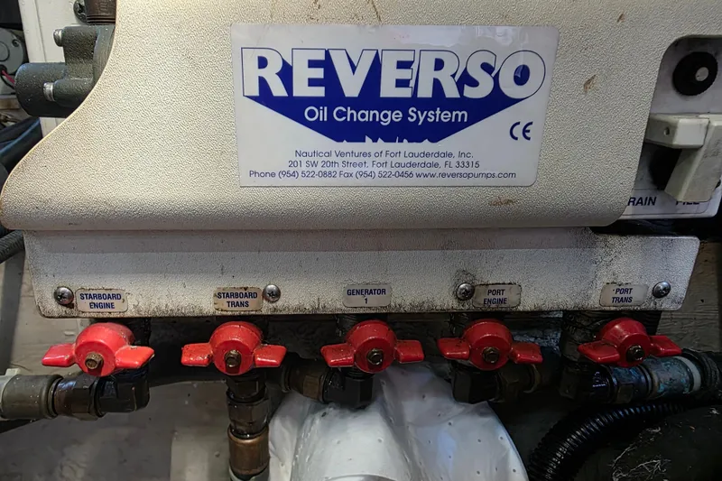 Slide: The Image of Reverso oil change system on 2002 Sea Ray 560 Sedan Bridge with labeled valves. - 161