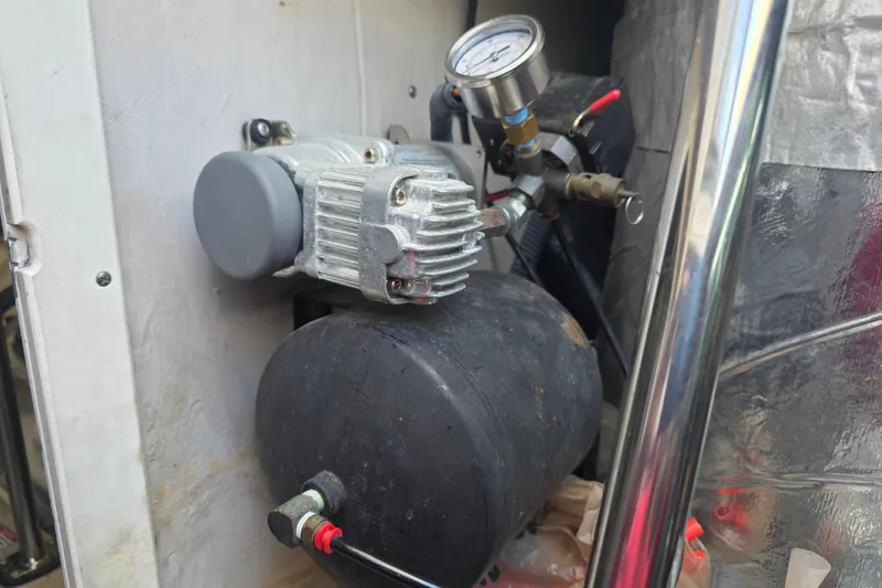 Slide: The Image of Engine component of a 2002 Sea Ray 560 Sedan Bridge yacht, featuring a pressure gauge. - 166