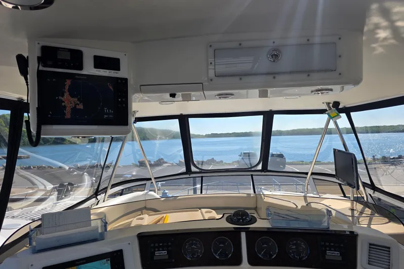 Slide: The Image of Interior view of 2002 Sea Ray 560 Sedan Bridge yacht cockpit with navigation equipment. - 46