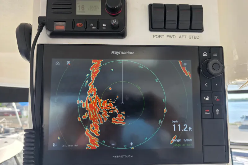 Slide: The Image of Raymarine navigation display on 2002 Sea Ray 560 Sedan Bridge, showing radar and depth information. - 49