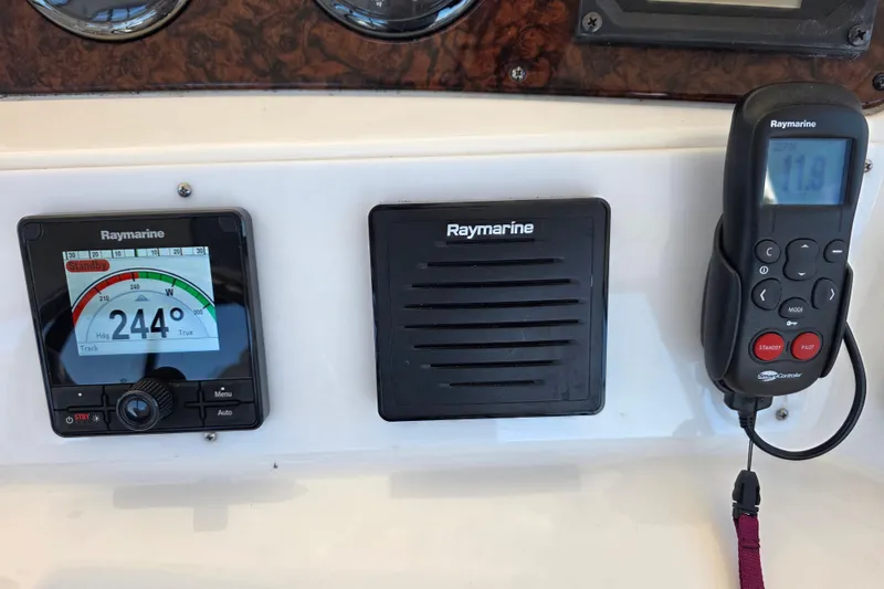 Slide: The Image of Raymarine navigation equipment on 2002 Sea Ray 560 Sedan Bridge yacht dashboard. - 60