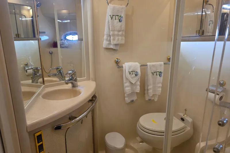 Slide: The Image of Luxurious bathroom in 2002 Sea Ray 560 Sedan Bridge yacht, featuring elegant fixtures and towels. - 82