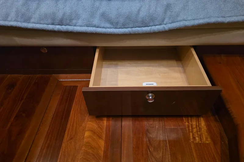 Slide: The Image of Open wooden drawer on Sea Ray 560 Sedan Bridge yacht, 2002 model, with polished floor. - 90