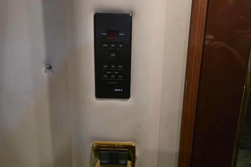 Slide: The Image of Control panel on a 2002 Sea Ray 560 Sedan Bridge yacht interior wall. - 92