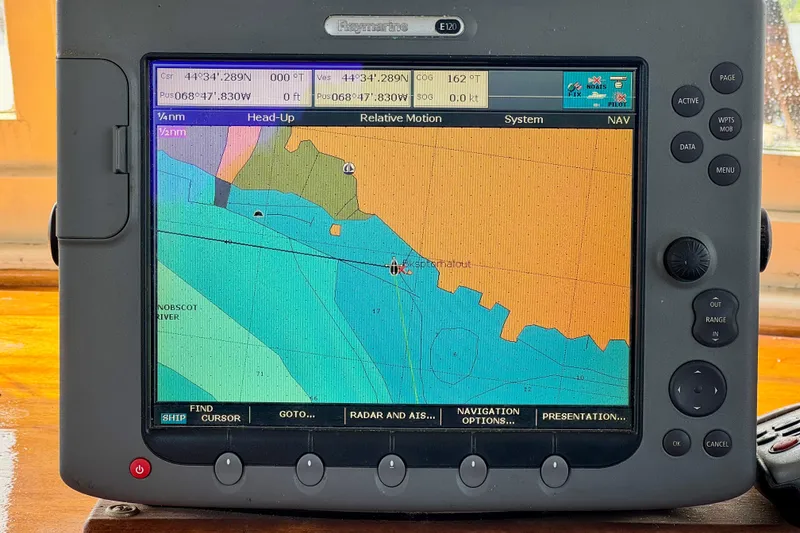 Slide: The Image of Navigation system on a 1976 Downeast Flybridge Cruiser displaying a nautical chart. - 14