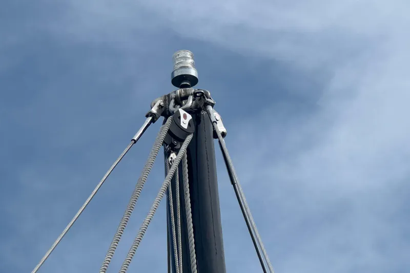Slide: The Image of Mast top of 1976 Downeast Flybridge Cruiser against blue sky. - 67