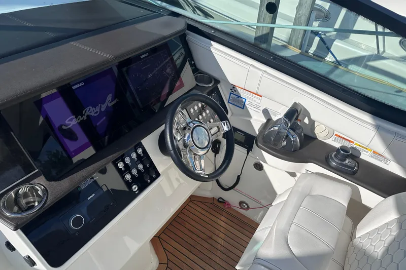 Slide: The Image of Luxurious interior of 2020 Sea Ray Sundancer 320 Coupe with elegant seating and wooden table. - 14