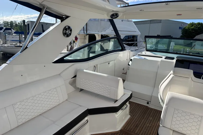 Slide: The Image of Luxurious interior of 2020 Sea Ray Sundancer 320 Coupe with white seating and sleek design. - 15