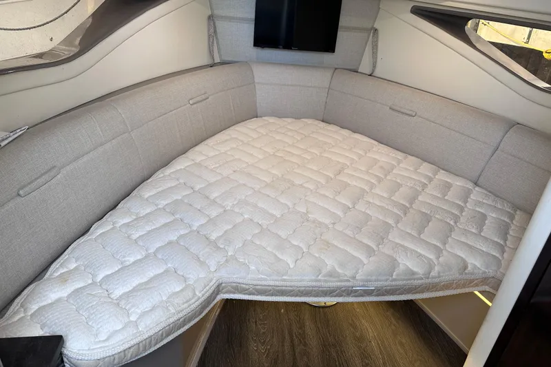 Slide: The Image of Interior cabin of 2020 Sea Ray Sundancer 320 Coupe with cushioned bed and modern design. - 22