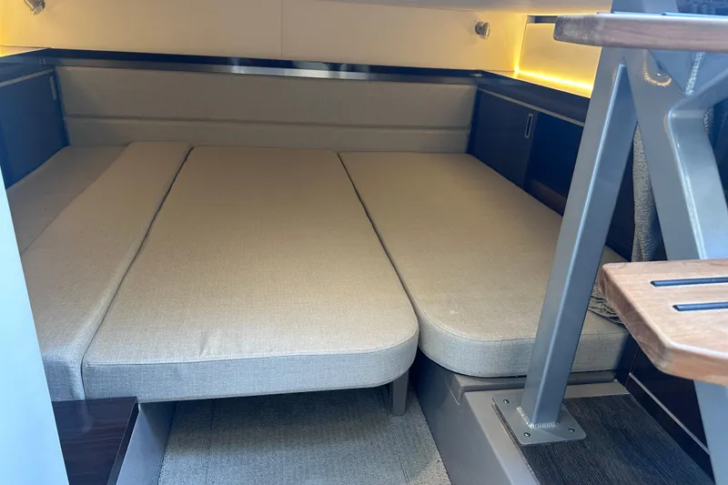 Slide: The Image of Interior cabin of 2020 Sea Ray Sundancer 320 Coupe with beige cushions and modern design. - 25