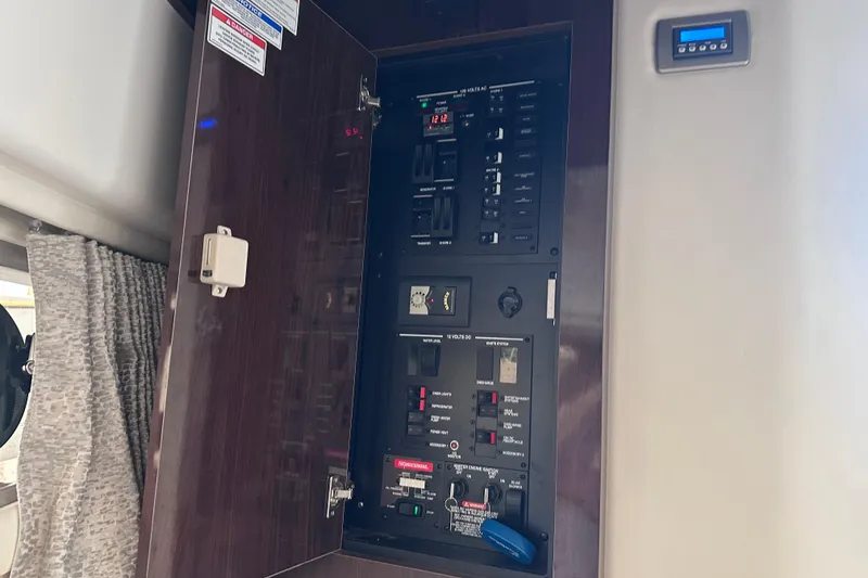 Slide: The Image of Electrical panel inside 2020 Sea Ray Sundancer 320 Coupe yacht cabin. - 30