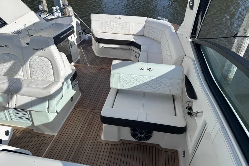 Slide: The Image of Manufacturer Provided Image: Aerial view of 2020 Sea Ray Sundancer 320 Coupe cruising on turquoise water. - 32