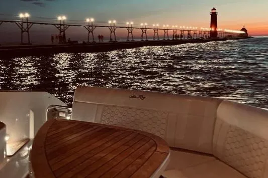Slide: The Image of Manufacturer Provided Image: 2020 Sea Ray Sundancer 320 Coupe bow lounge area with cushions and pillows. - 34