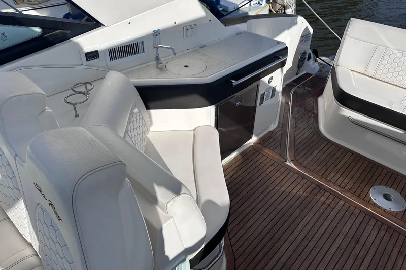 Slide: The Image of Manufacturer Provided Image: 2020 Sea Ray Sundancer 320 Coupe bow seating area with beige cushions. - 35
