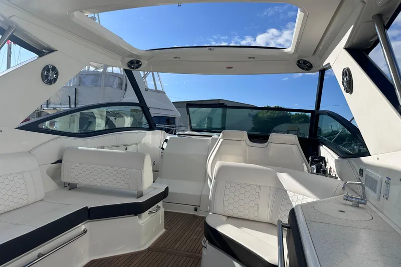 Slide: The Image of Manufacturer Provided Image: Interior cabin of 2020 Sea Ray Sundancer 320 Coupe with twin beds and modern decor. - 37