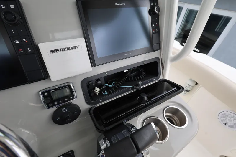 Slide: The Image of Control panel of a 2016 Boston Whaler 250 Outrage boat with Mercury electronics. - 13