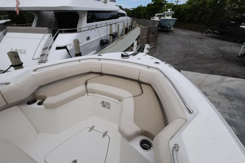 Slide: The Image of 2016 Boston Whaler 250 Outrage boat with spacious seating at the dock. - 16