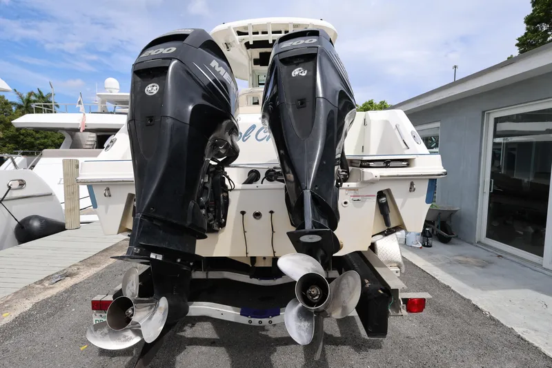 Slide: The Image of 2016 Boston Whaler 250 Outrage with dual Mercury 200 engines at dockside. - 4