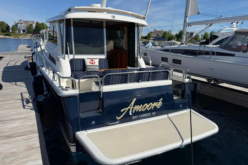 Slide: The Image of 2017 Sabre 38 Salon Express yacht docked at marina, named "Amoré," Bay Harbor, MI. - 13