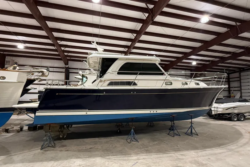 Slide: The Image of 2017 Sabre 38 Salon Express yacht in indoor storage, elevated on stands. - 16