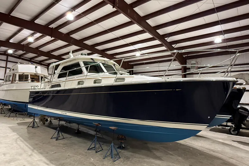 Slide: The Image of 2017 Sabre 38 Salon Express yacht in indoor storage, showcasing sleek design and craftsmanship. - 17