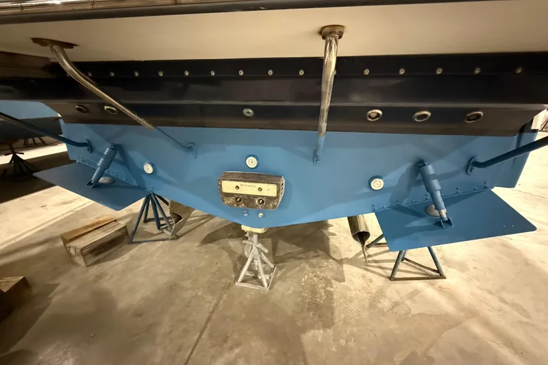 Slide: The Image of 2017 Sabre 38 Salon Express boat hull in a storage facility. - 19