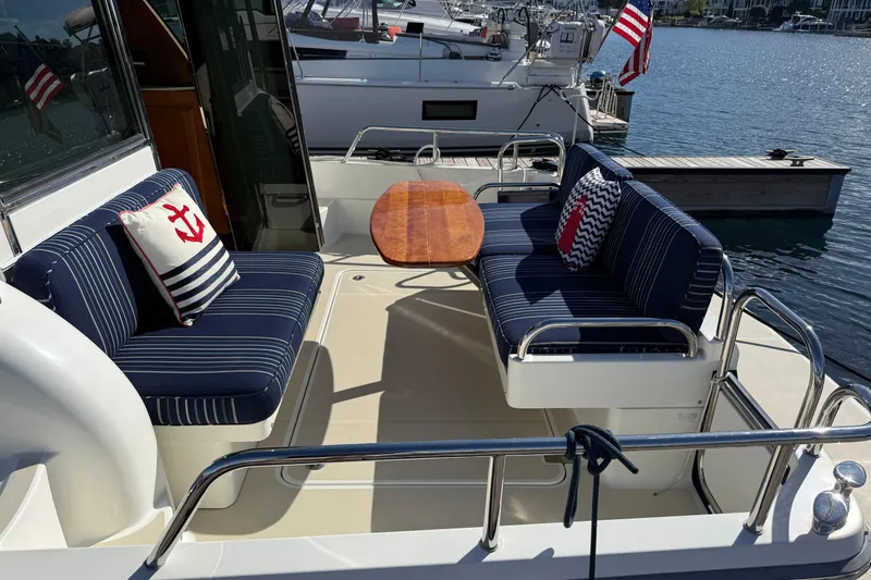 Slide: The Image of 2017 Sabre 38 Salon Express yacht with striped seating and nautical-themed cushions. - 20