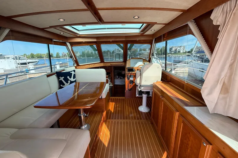 Slide: The Image of Interior of 2017 Sabre 38 Salon Express yacht with elegant wood finish and waterfront view. - 33