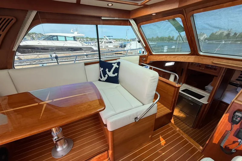 Slide: The Image of Interior of 2017 Sabre 38 Salon Express yacht with wooden finishes and white seating. - 36