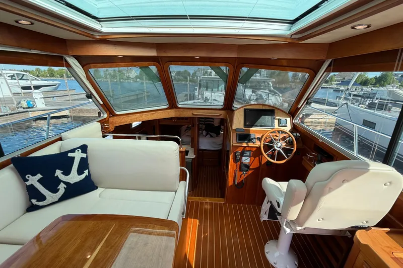 Slide: The Image of Interior of 2017 Sabre 38 Salon Express yacht with helm and seating area. - 37