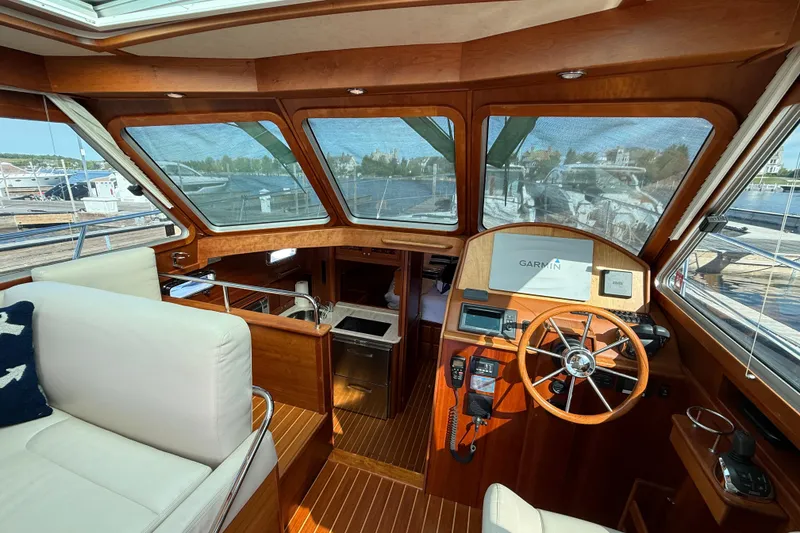 Slide: The Image of Interior view of 2017 Sabre 38 Salon Express yacht with wooden helm and navigation equipment. - 38