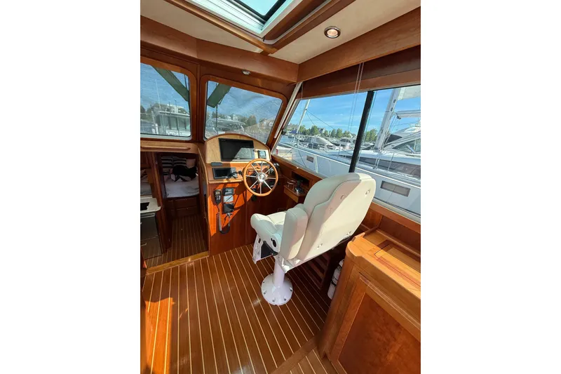Slide: The Image of Interior of 2017 Sabre 38 Salon Express yacht with wooden finish and captain's chair. - 42