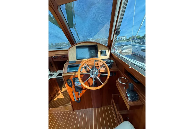 Slide: The Image of Helm of 2017 Sabre 38 Salon Express with wooden steering wheel and navigation equipment. - 43