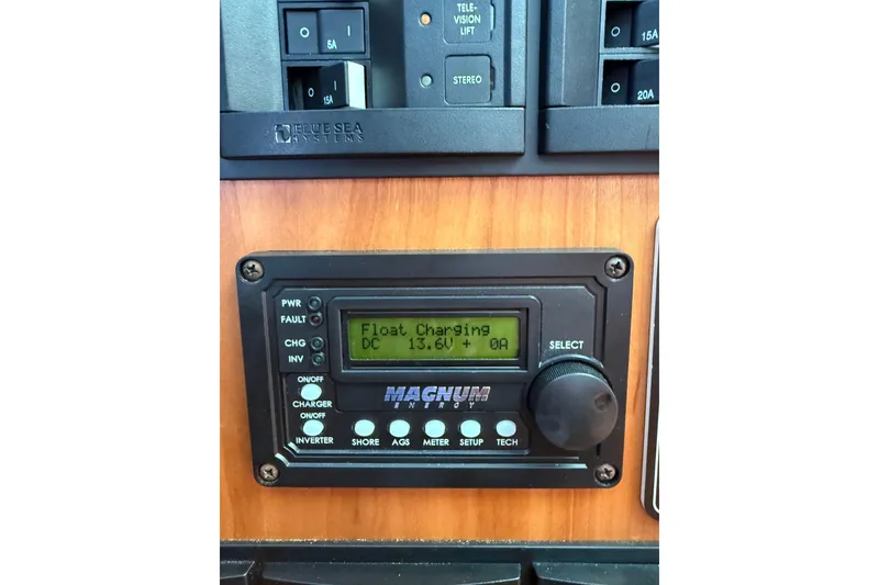 Slide: The Image of Control panel on a 2017 Sabre 38 Salon Express displaying float charging status. - 47